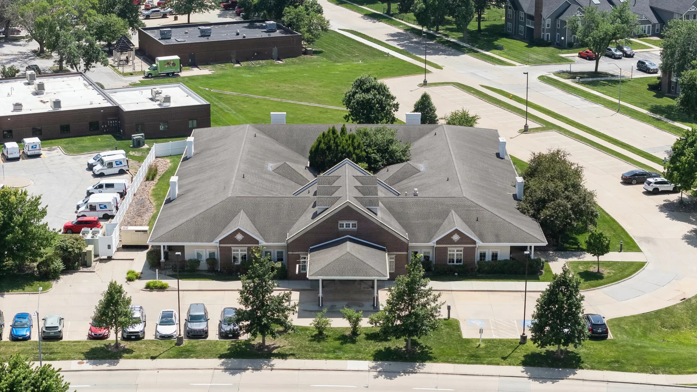 Des Moines Wellness Center seen from above, showing the main entrance and visitor parking